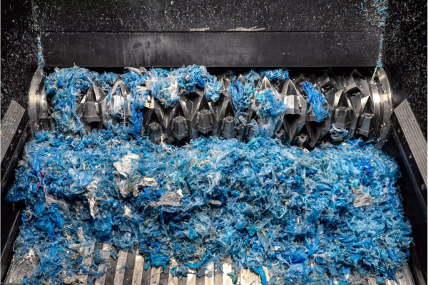Feeding lightweight plastic materials.